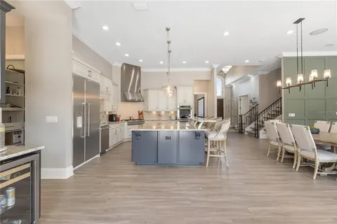 a view of living room with furniture and wooden floor