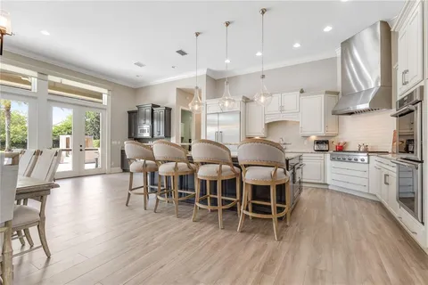 a kitchen with a stove oven and a sink