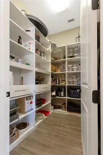 a view of a hallway with a bathroom