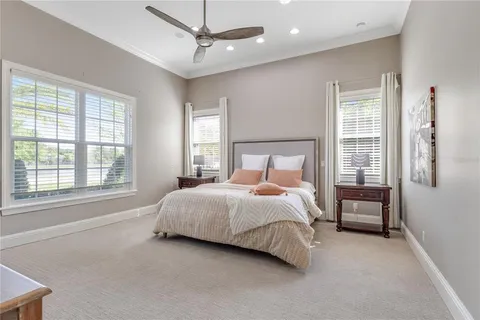 a bedroom with bed and window