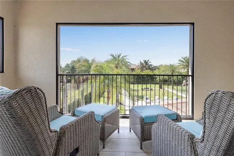 a front view of a house with a yard table and chairs