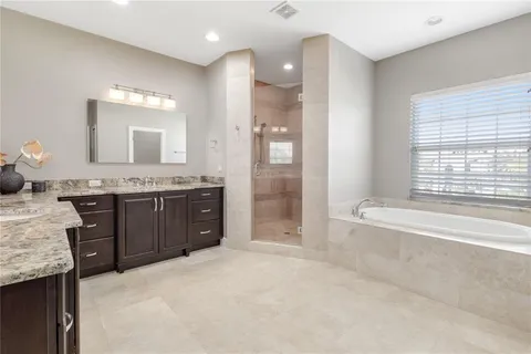 a swimming pool with an outdoor space and seating area