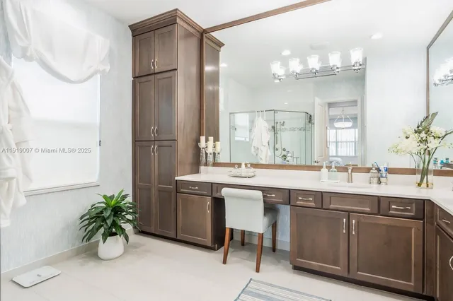 a kitchen with a sink and a refrigerator