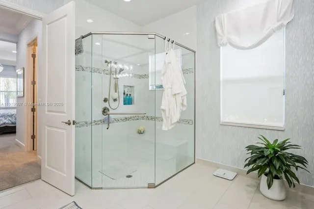 a bathroom with a shower and a tub