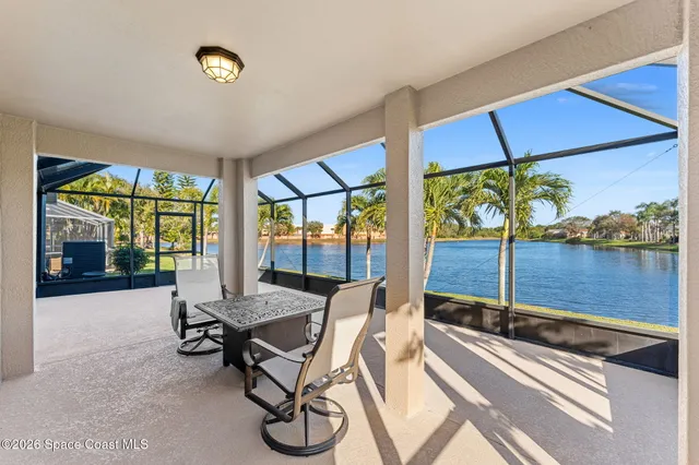 a view of a patio with a table and chairs