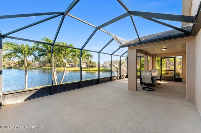 a view of a lake with houses in the background