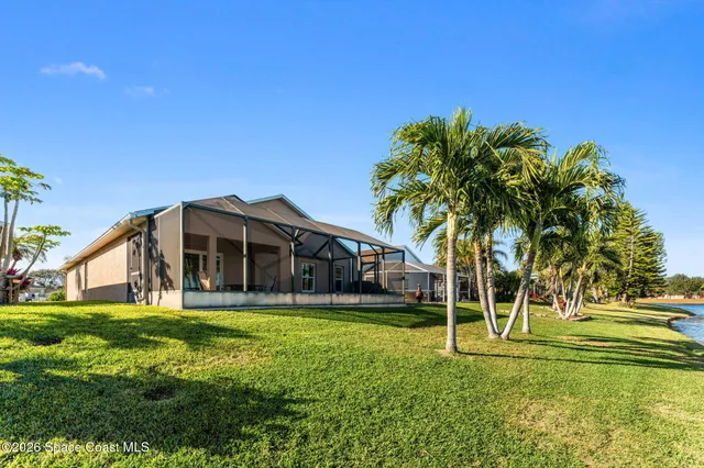 an aerial view of a house with a swimming pool