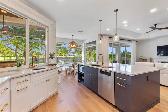 a view of a dining room with furniture chandelier and wooden floor