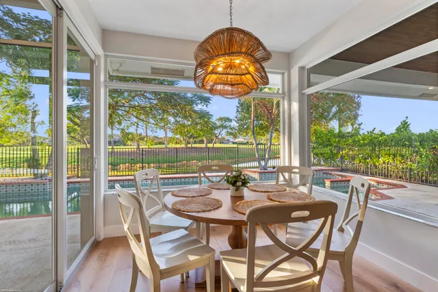 a workspace with furniture window and wooden floor