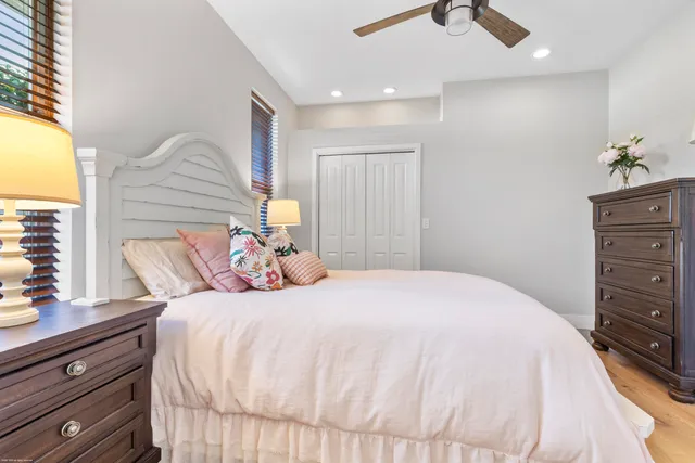 a bedroom with a bed and a closet