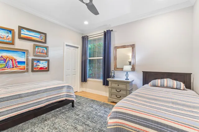 a bathroom with a granite countertop sink a toilet and shower