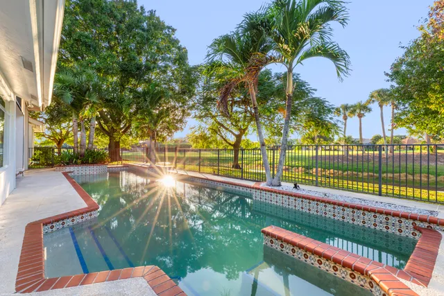 a view of street along with house and trees