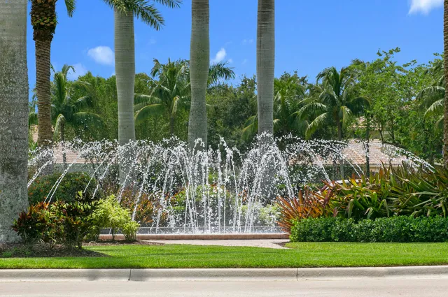 an aerial view of a residential houses outdoor space and swimming pool