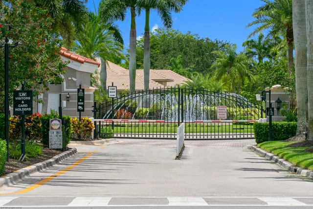 an aerial view of residential houses with outdoor space and street view