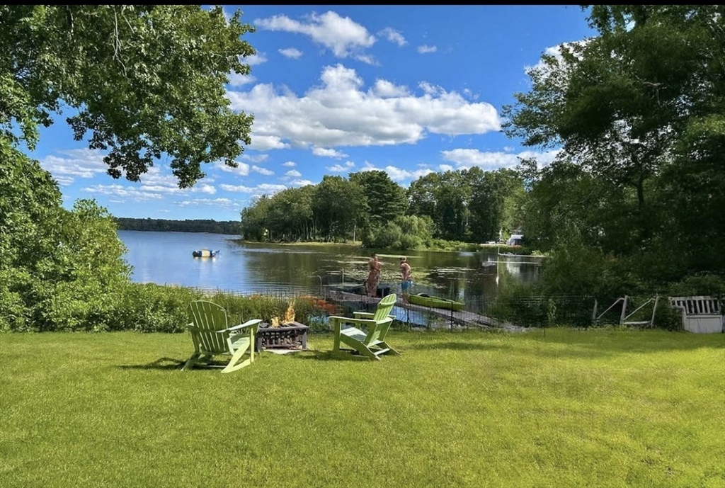 a view of a lake with a yard