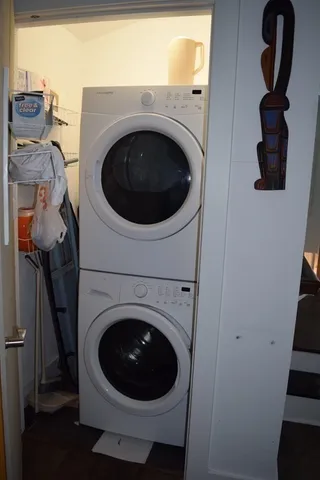 a close view of a utility room with dryer and washer