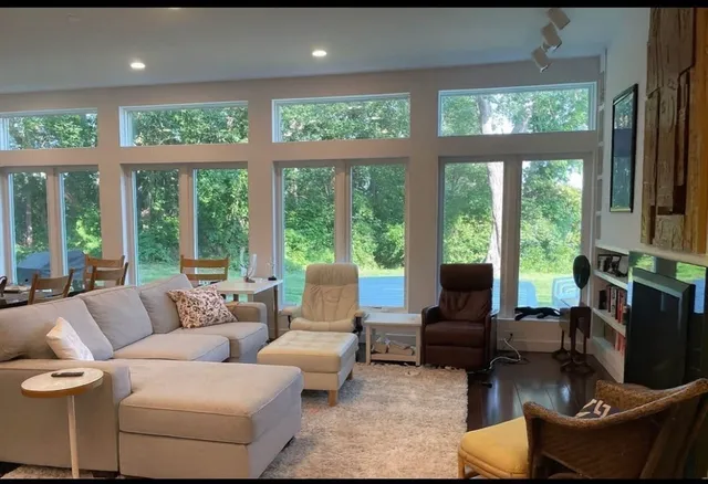 a living room with furniture and a large window
