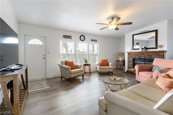 a kitchen with stainless steel appliances granite countertop a sink stove refrigerator and cabinets