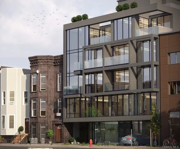 a front view of a building with a lot of windows