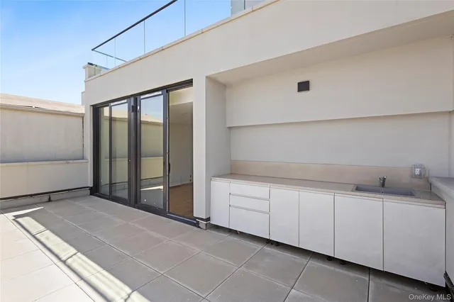 a room with a walk in closet and a bathroom