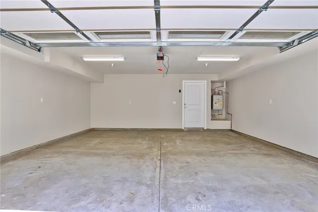 an outdoor space with patio and white umbrellas