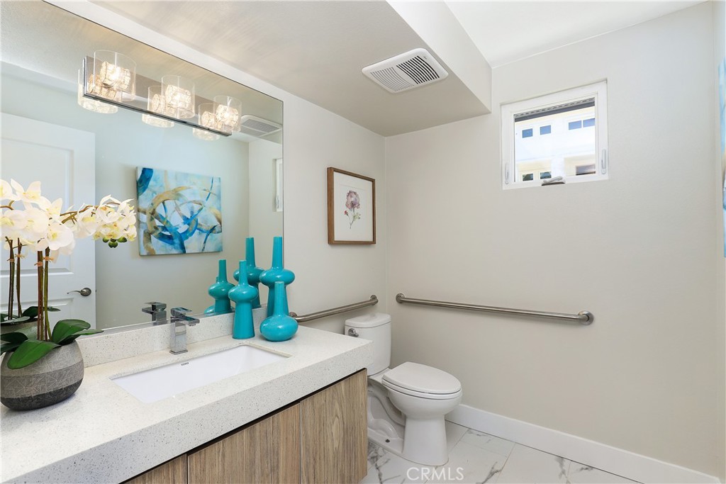 1 Turnberry Lane Phillips Ranch, CA 91766 - Photo 7 of 63 a bathroom with a sink a toilet and a mirror
