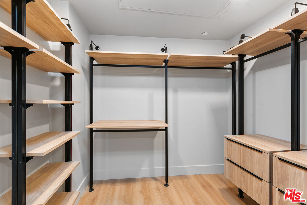 12431 Rochester Avenue, Unit PH4 Los Angeles, CA 90025 - Photo 15 of 28 a view of walk in closet with empty racks