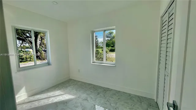 a kitchen with a sink and a refrigerator
