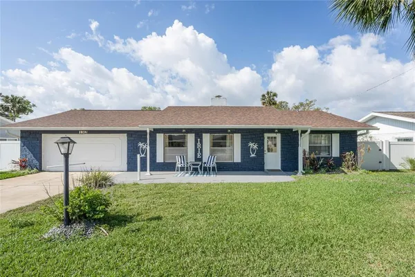front view of a house with a yard