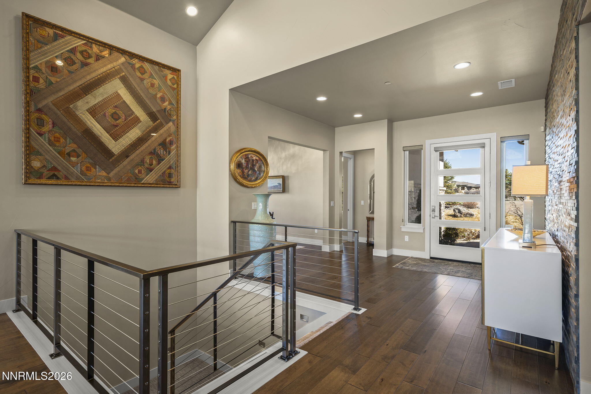 4856 Sierra Pine Court Reno, NV 89519 - Photo 12 of 71 a view of a hallway with wooden floor and a potted plant