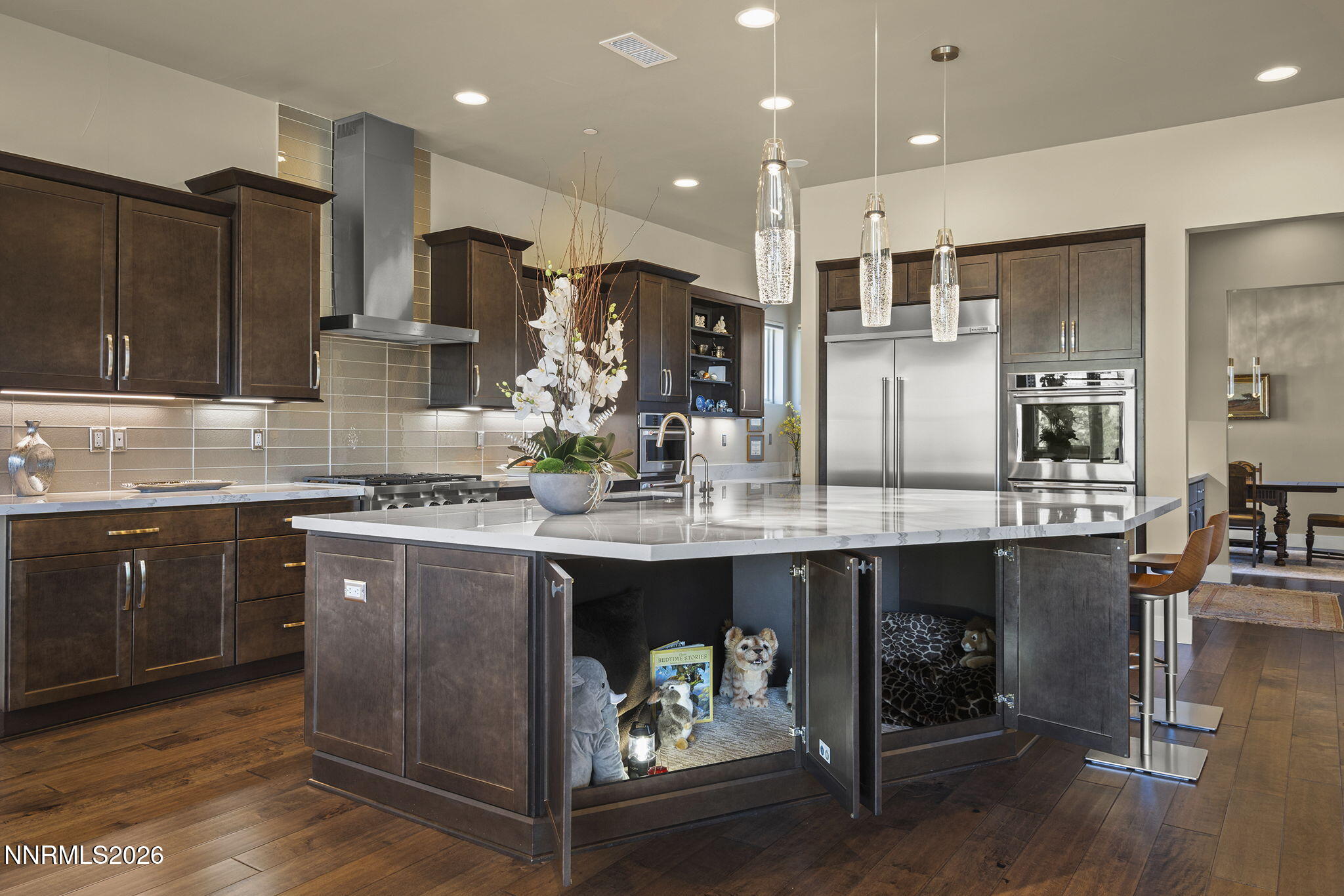 4856 Sierra Pine Court Reno, NV 89519 - Photo 20 of 71 a kitchen with kitchen island granite countertop wooden cabinets and refrigerator