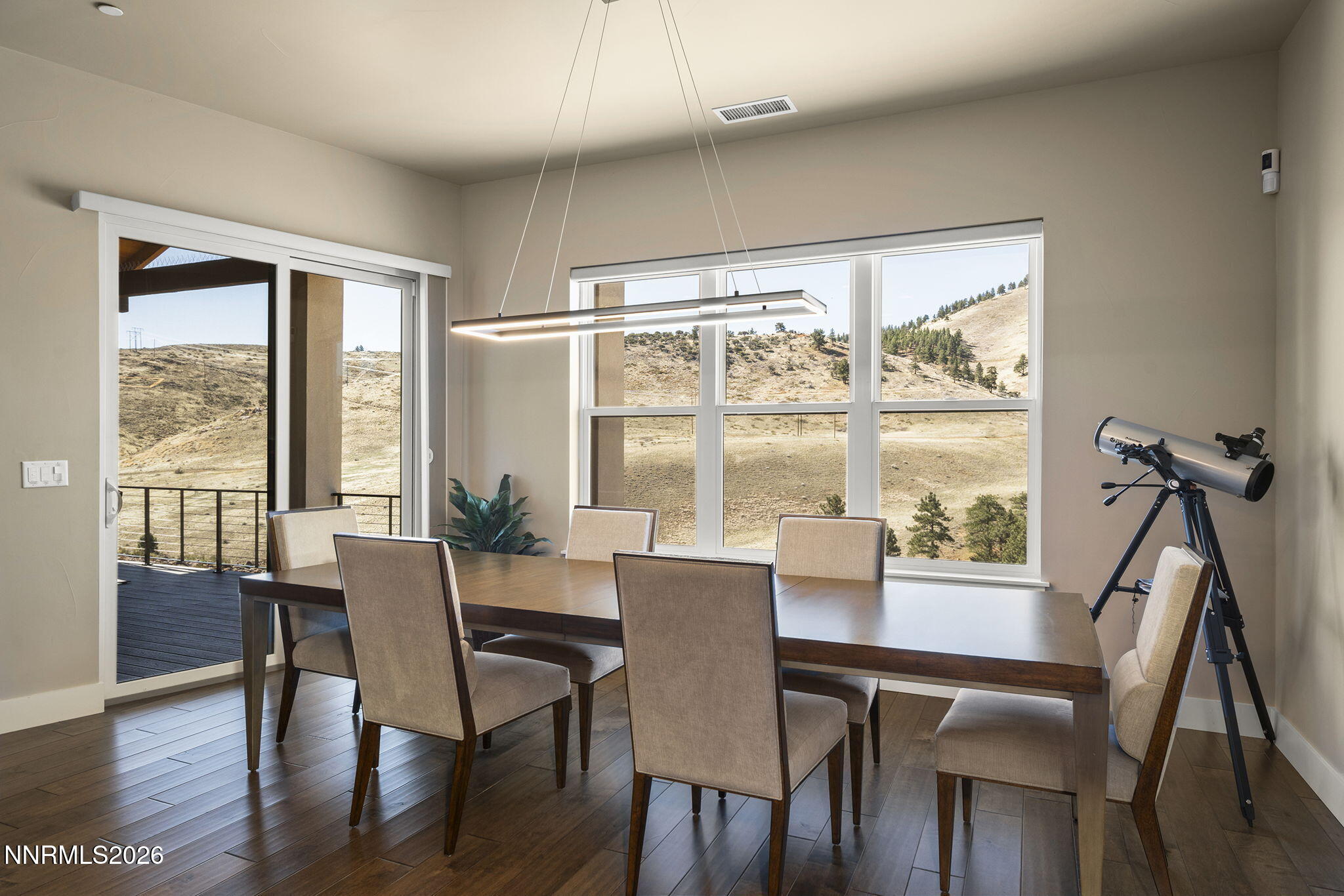 4856 Sierra Pine Court Reno, NV 89519 - Photo 23 of 71 a view of a dining room with furniture window and wooden floor