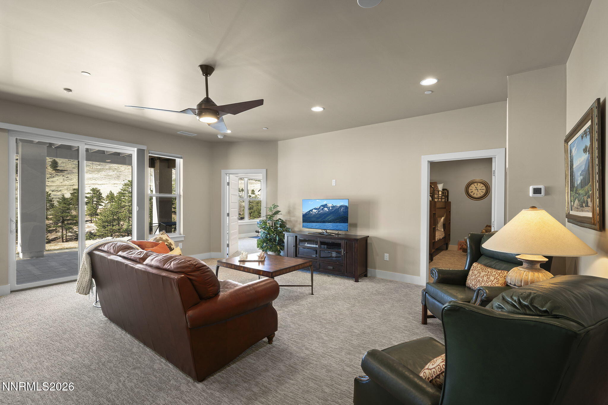 4856 Sierra Pine Court Reno, NV 89519 - Photo 37 of 71 a living room with furniture chandelier and a large window