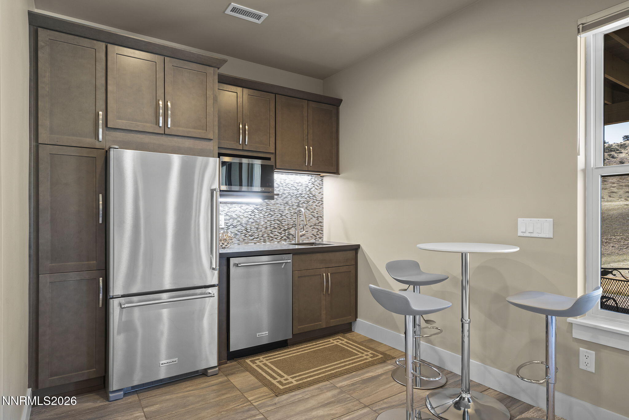 4856 Sierra Pine Court Reno, NV 89519 - Photo 39 of 71 a kitchen with stainless steel appliances granite countertop a refrigerator and a stove top oven