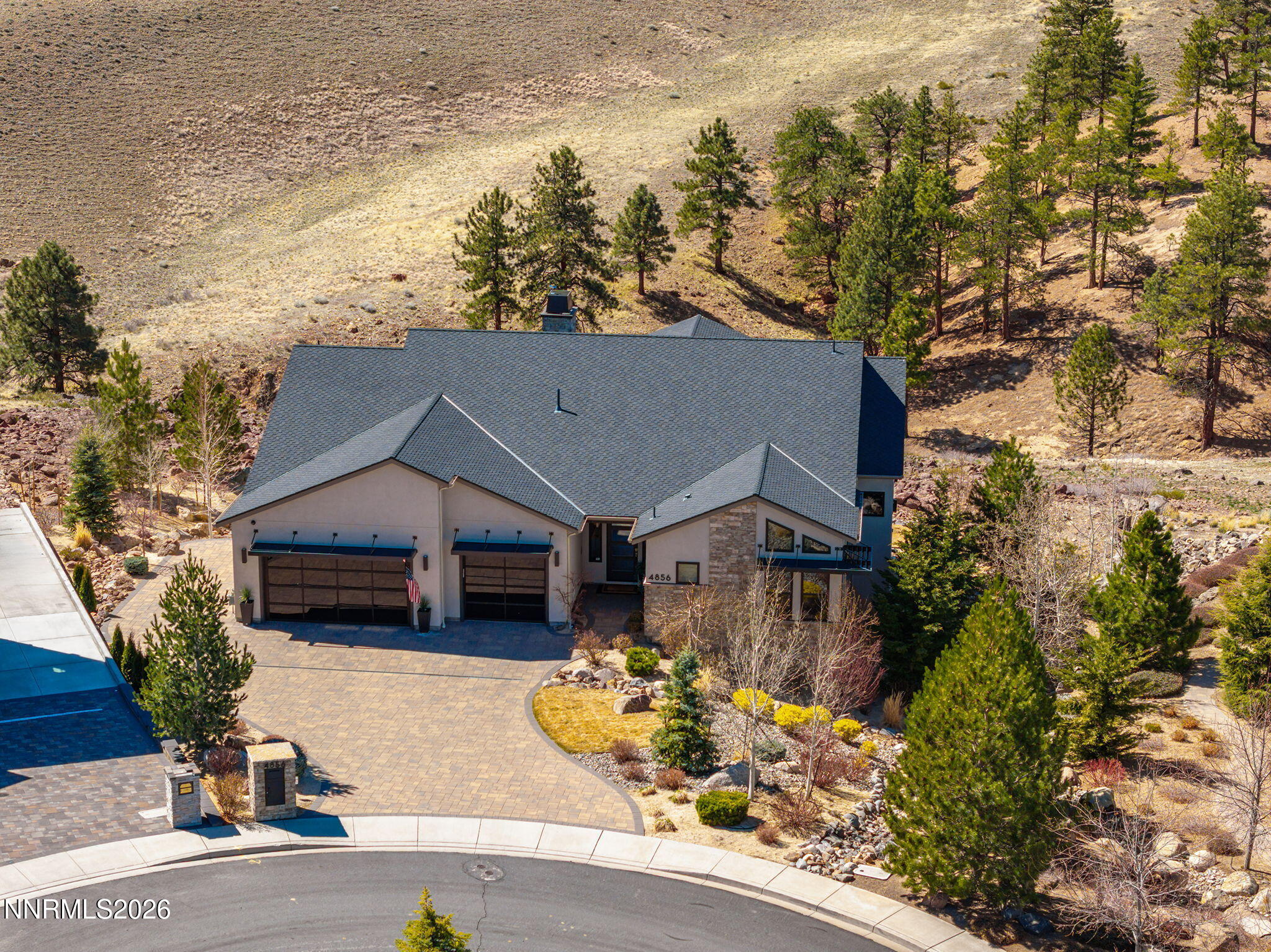 4856 Sierra Pine Court Reno, NV 89519 - Photo 9 of 71 an aerial view of a house with a yard and garden