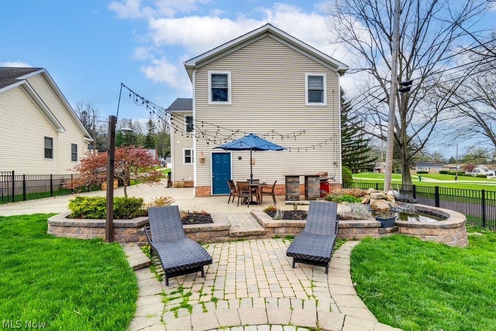 6325 Brecksville Road Independence, OH 44131 - Photo 47 of 50 Stamped concrete and paver patio, built in fire pit, along with a pond!