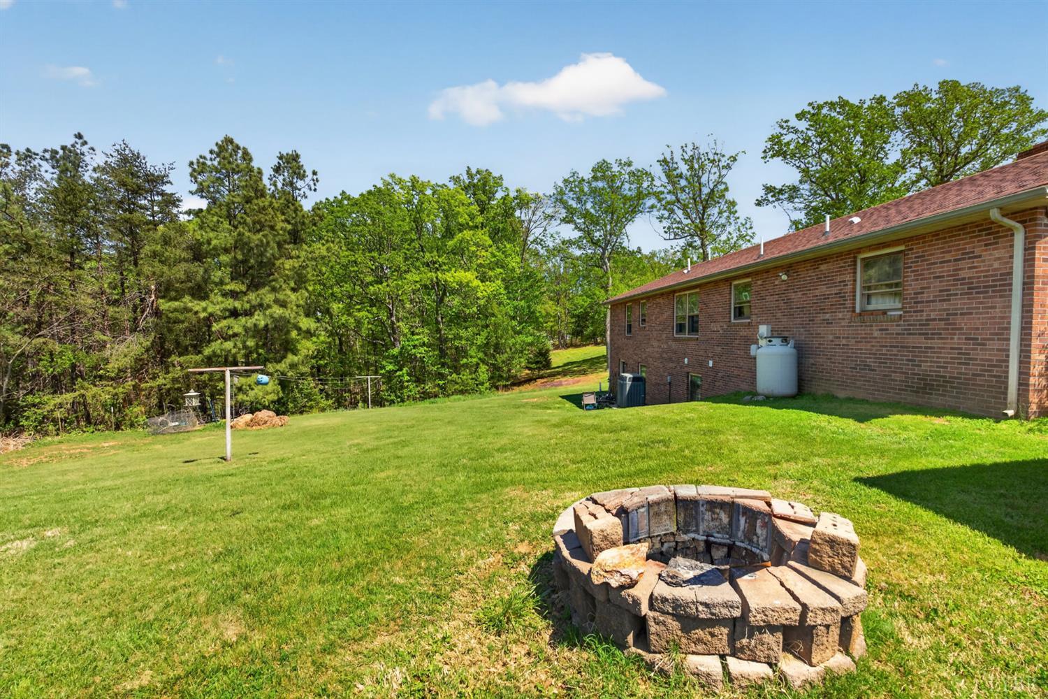 5225 Blue Ridge Drive Gretna, VA 24557 - Photo 26 of 28 a backyard of a house with table and chairs