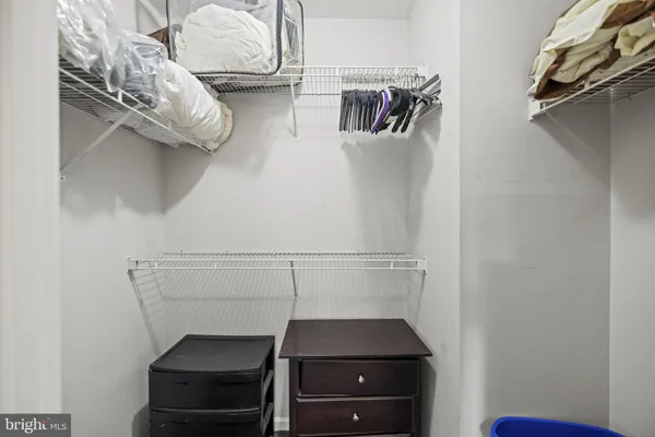 a view of storage and utility room with racks on the wall