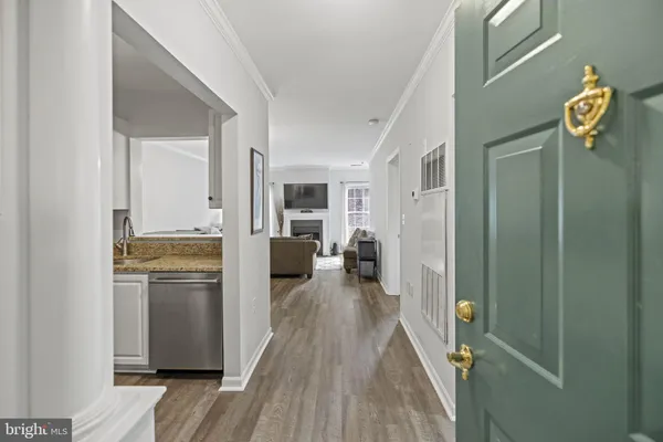 a kitchen with refrigerator and cabinets
