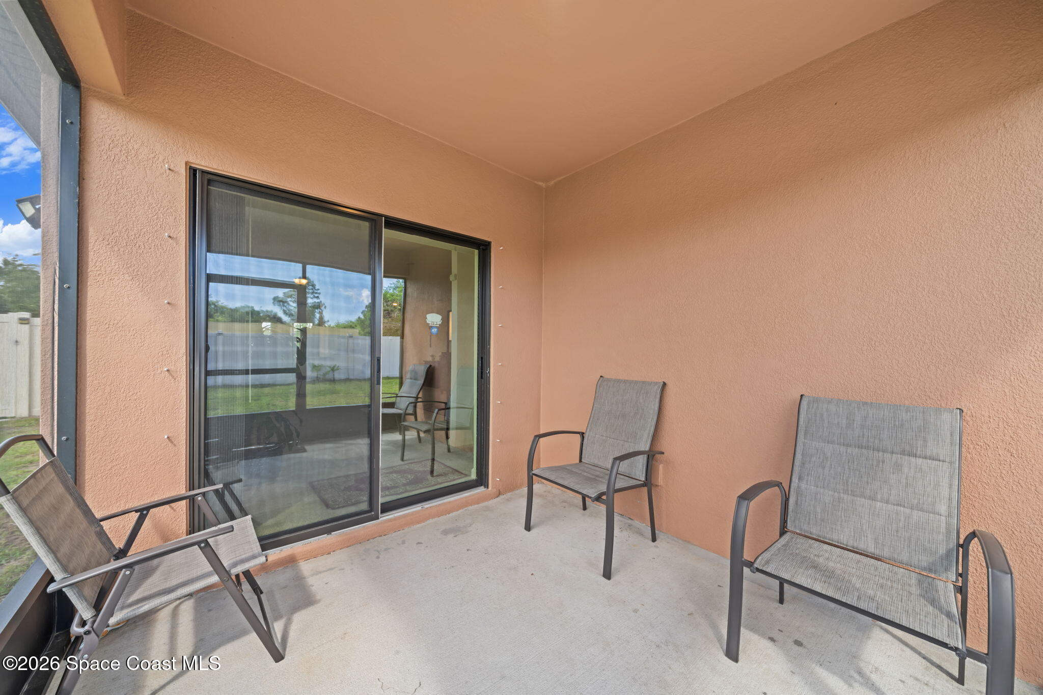3518 Loggerhead Lane Mims, FL 32754 - Photo 13 of 35 21-Covered-Back-Patio-with-Sliding-Door