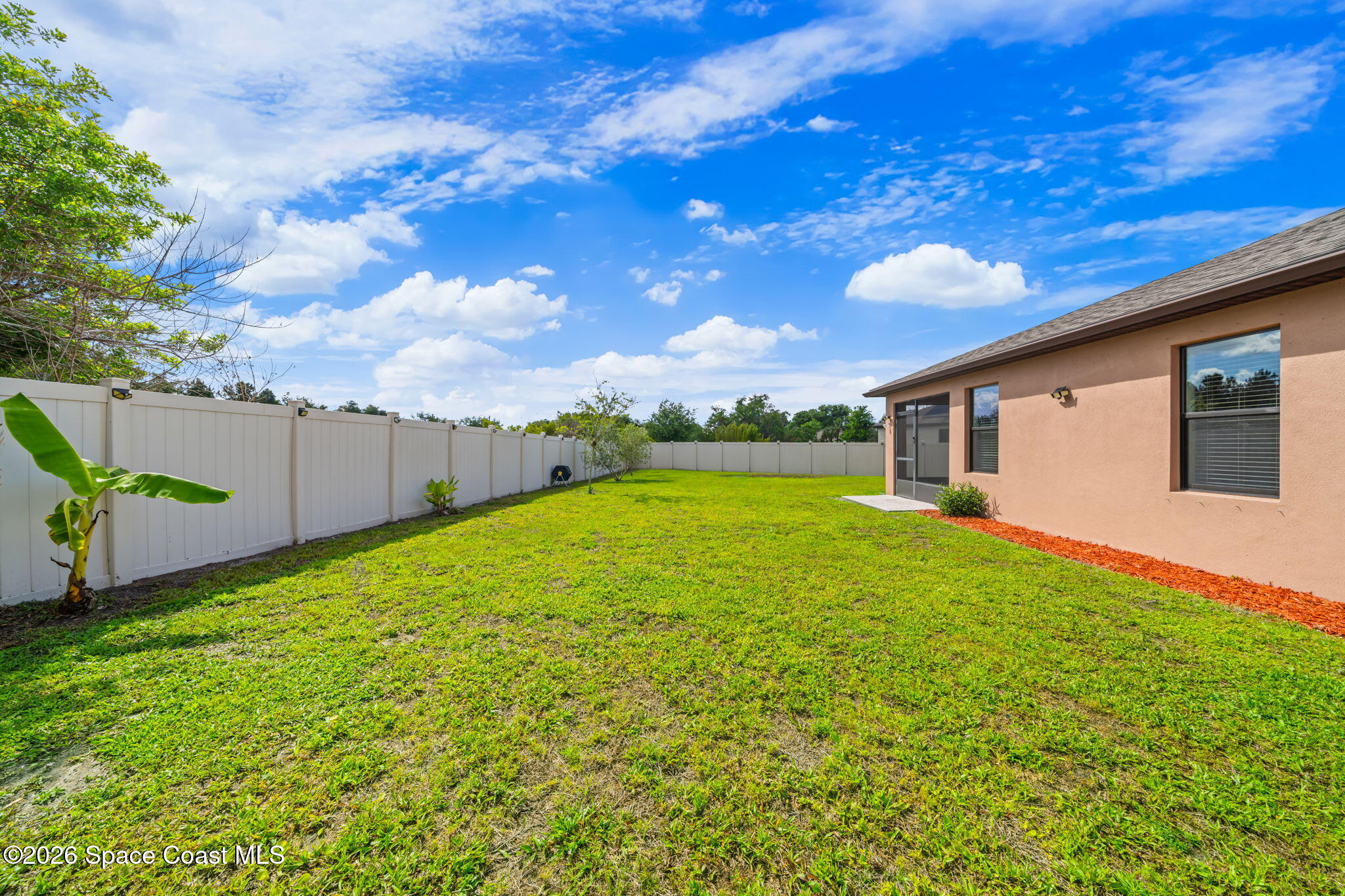 3518 Loggerhead Lane Mims, FL 32754 - Photo 14 of 35 23-Backyard-Fenced-Green-Lawn