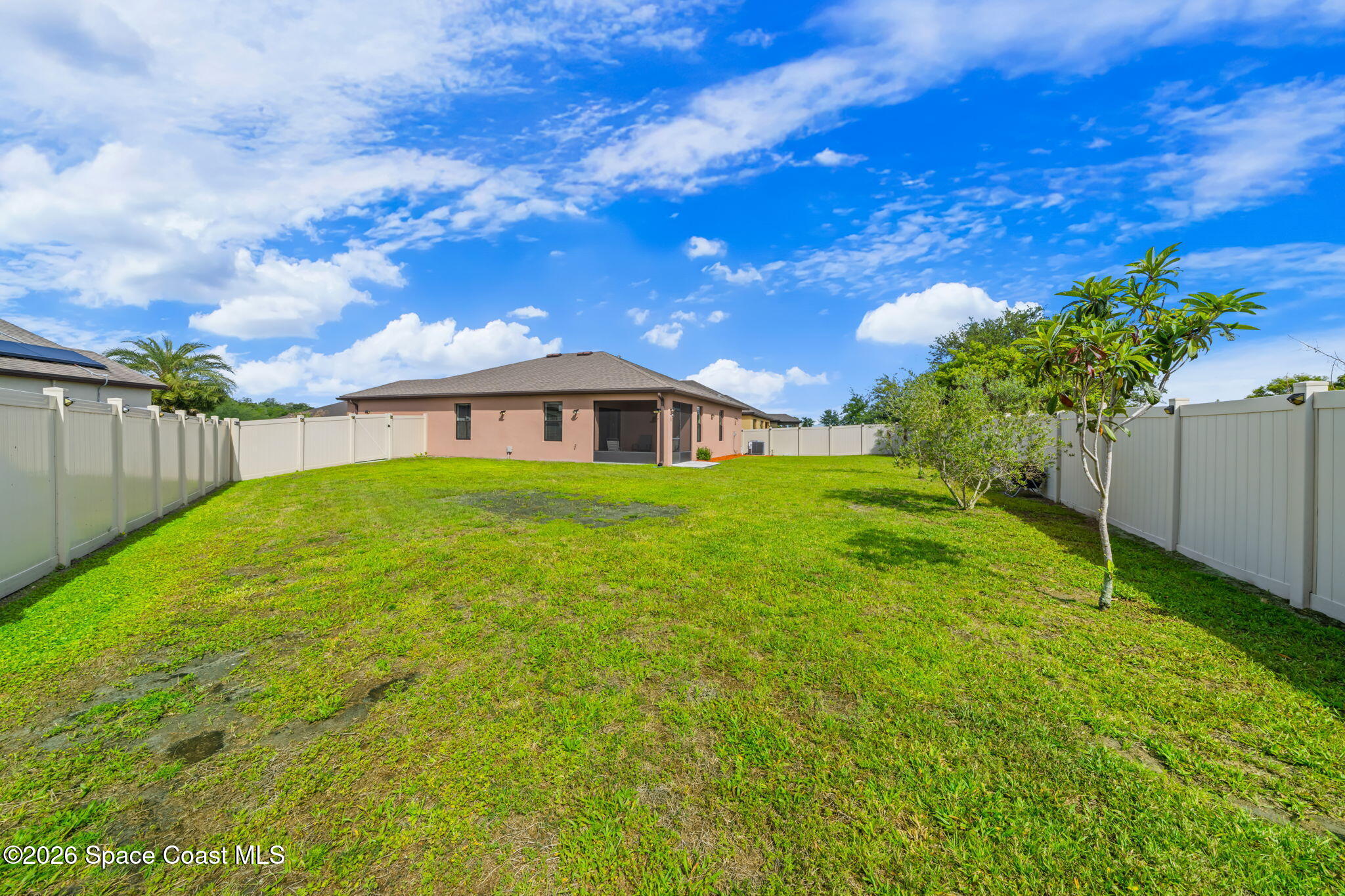 3518 Loggerhead Lane Mims, FL 32754 - Photo 15 of 35 24-Backyard-Full-Fenced-Yard-Rear-View
