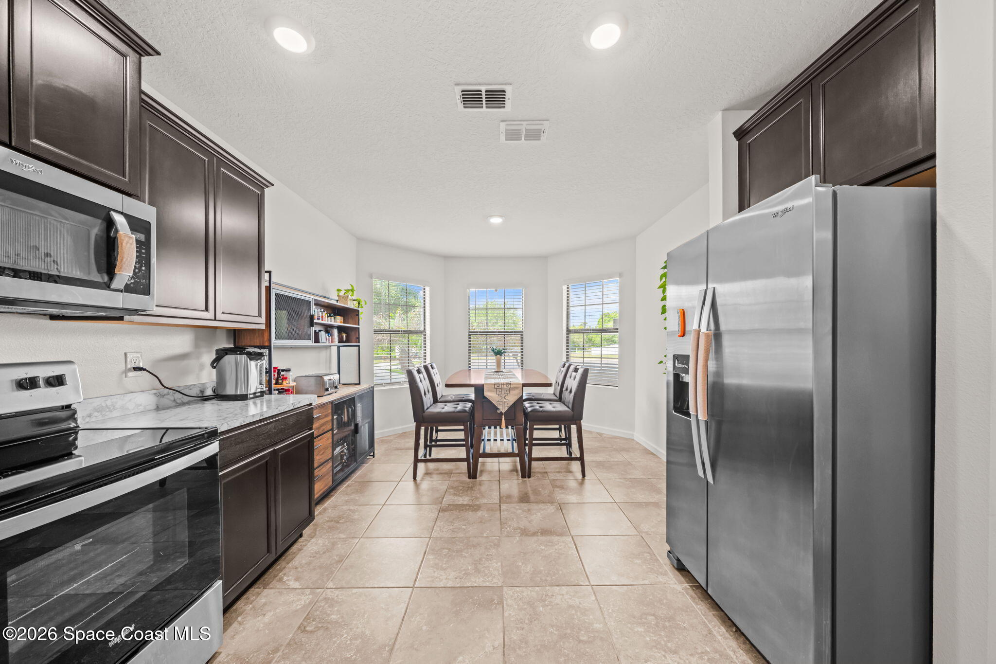 3518 Loggerhead Lane Mims, FL 32754 - Photo 34 of 35 11-Kitchen-Galley-View-with-Dining-Nook