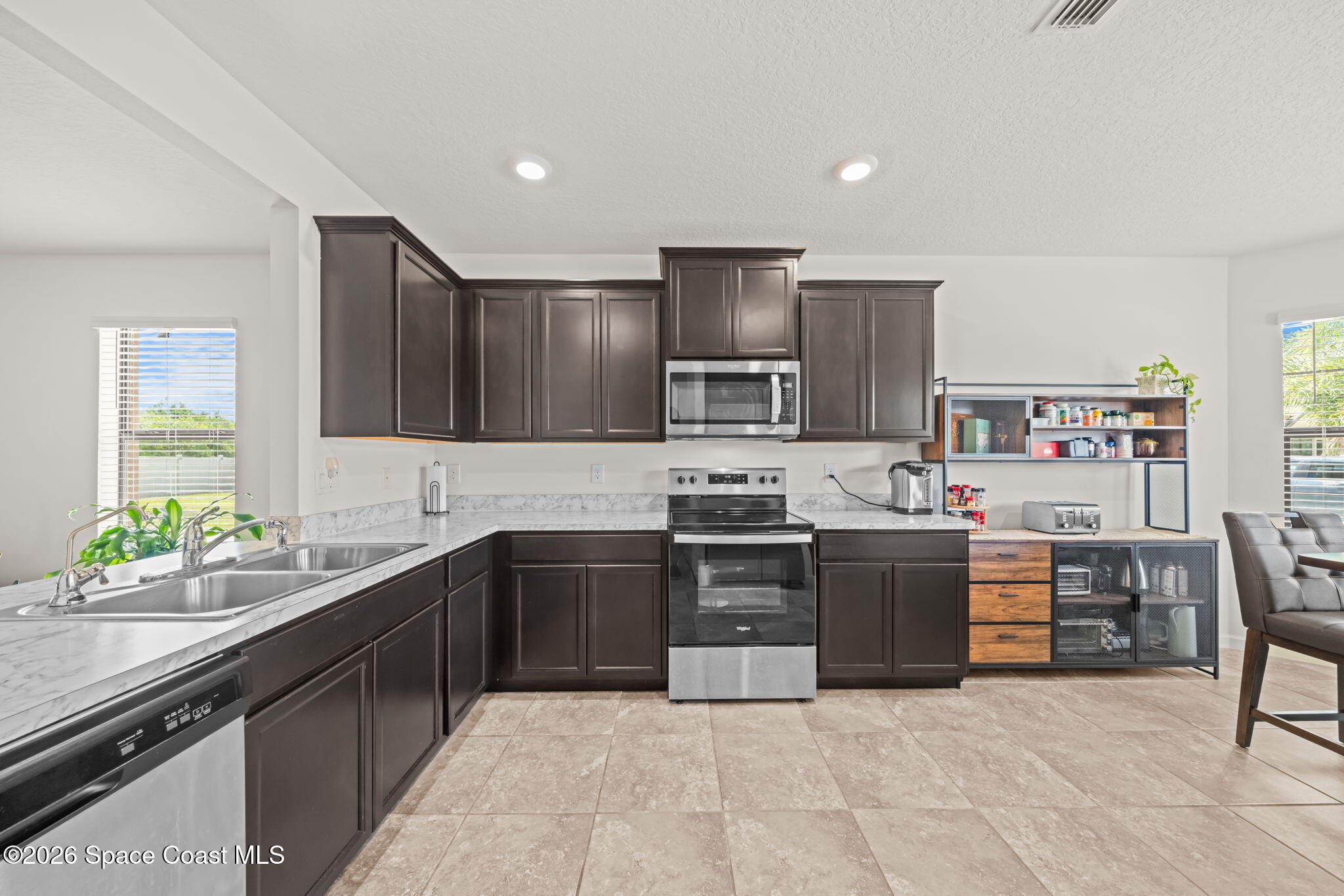 3518 Loggerhead Lane Mims, FL 32754 - Photo 4 of 35 12-Kitchen-Dark-Cabinets-Marble-Counters
