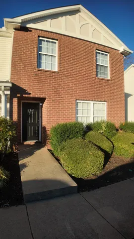 a house view with a garden space