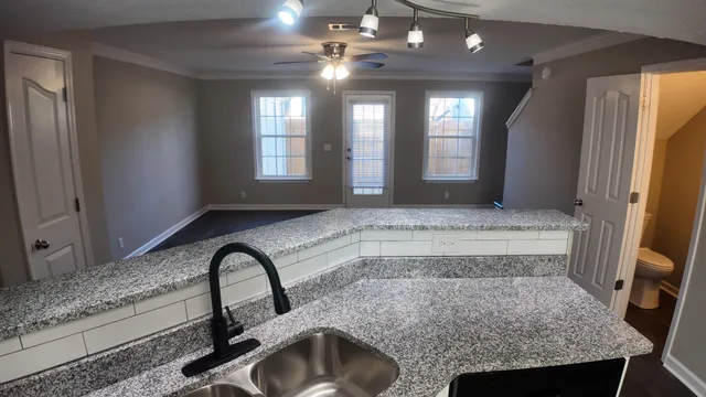 a view of bathroom with sink and mirror