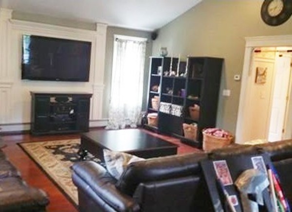 153 Old Worcester Road Charlton, MA 01507 - Photo 18 of 30 a living room with furniture and a flat screen tv
