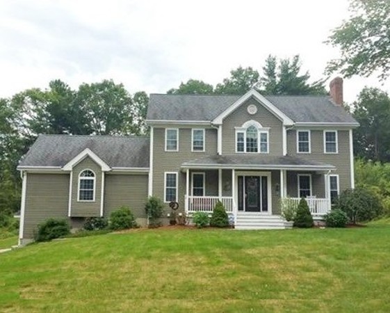 153 Old Worcester Road Charlton, MA 01507 - Photo 3 of 30 a front view of a house with a yard and trees