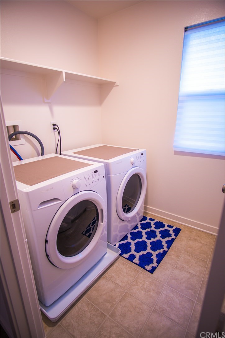 8865 Maple Avenue Montclair, CA 91763 - Photo 21 of 26 Second Floor Laundry Room. Washer and Dryer Included in the sale.