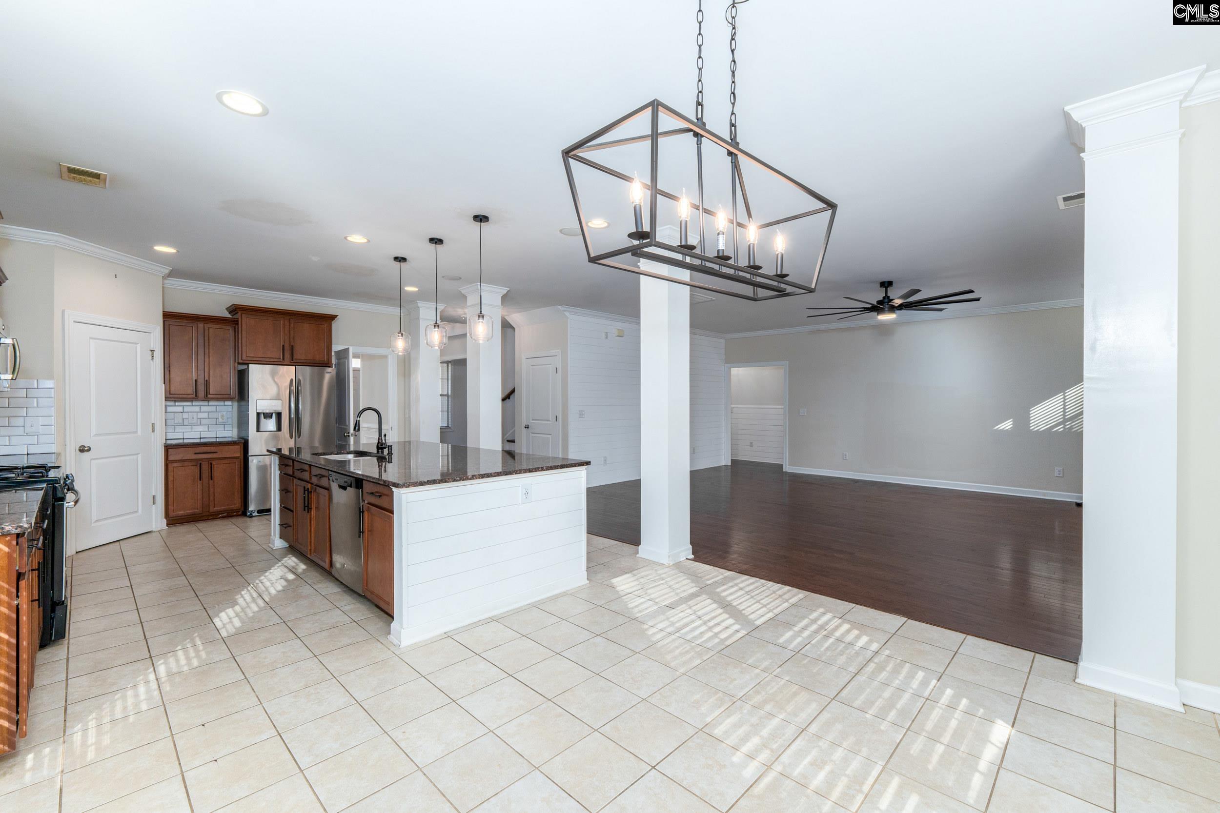 40 Wading Bird Loop Blythewood, SC 29016 - Photo 6 of 26 a view of a kitchen with kitchen island stainless steel appliances a chandelier open kitchen view